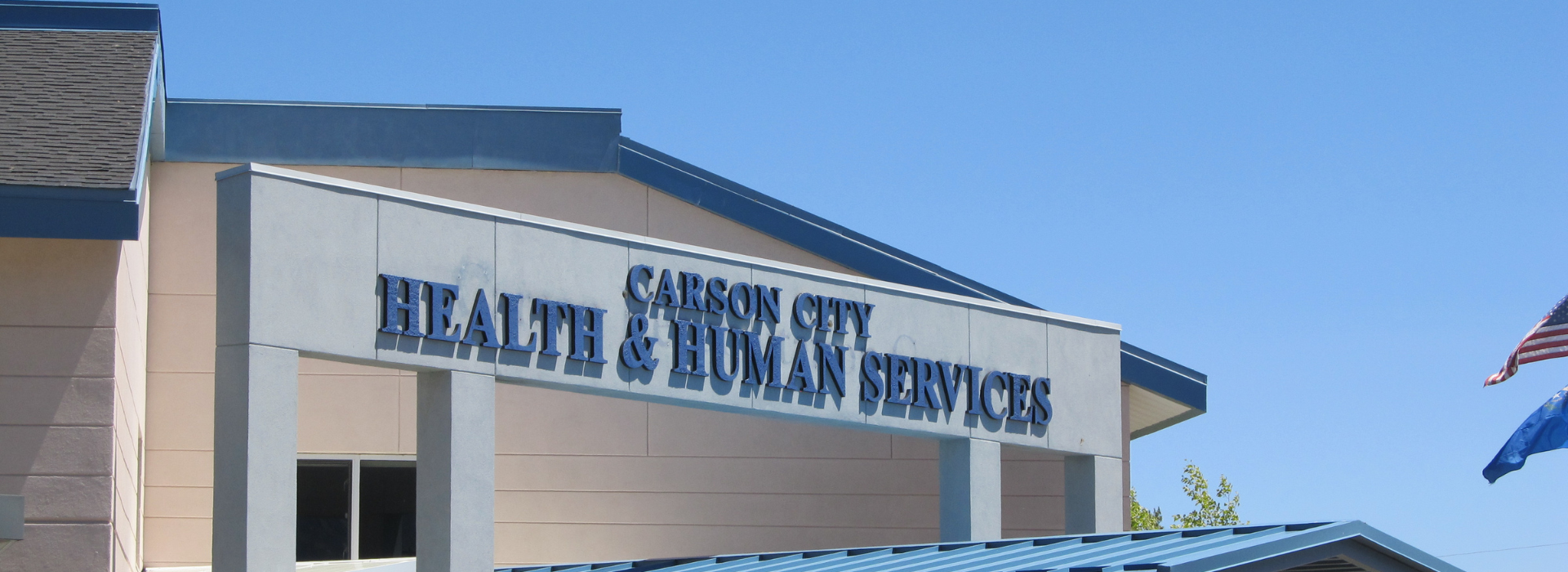 blue and white building with Carson City Health and Human Services on it